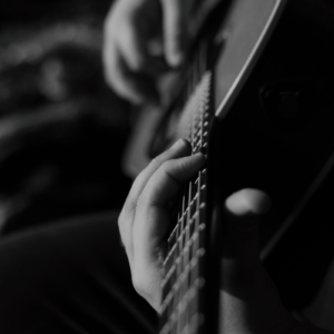 Man playing gospel acoustic guitar