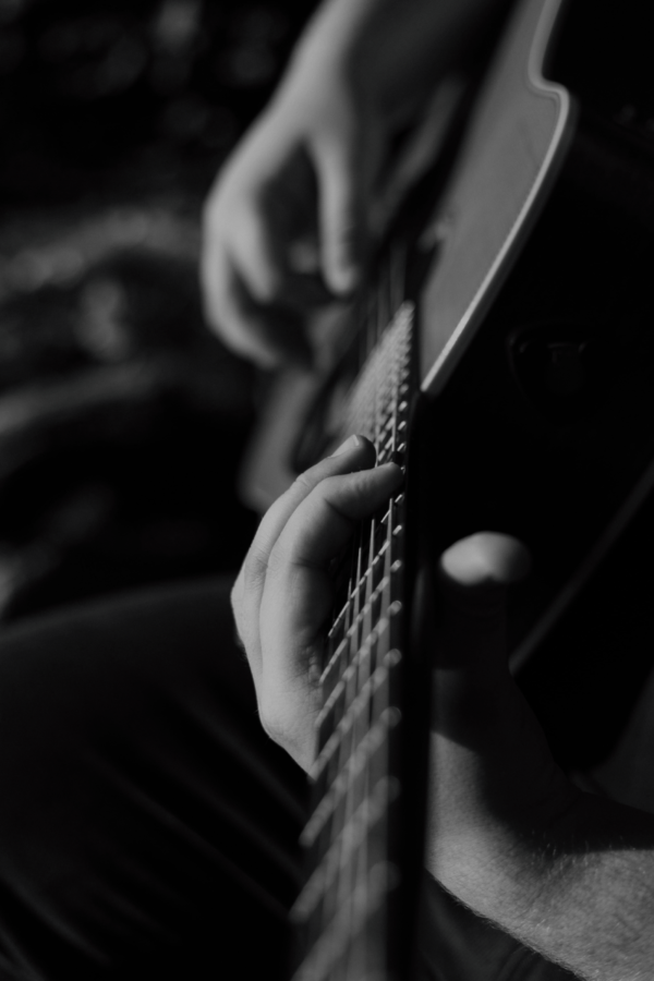 Man playing gospel acoustic guitar